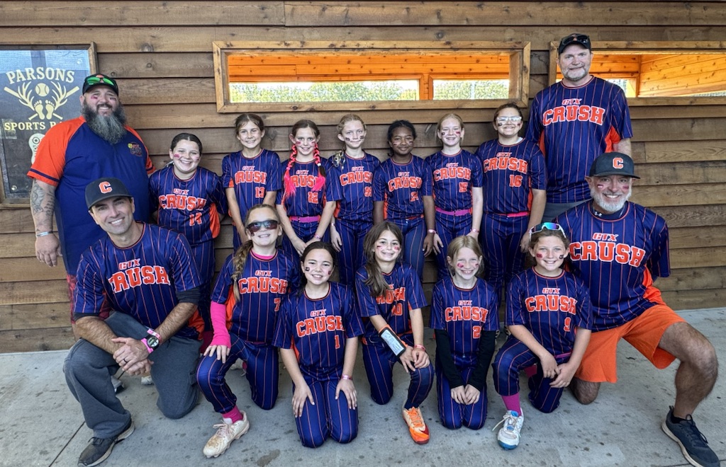 GTX Crush players and coaches together in navy uniforms